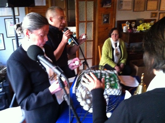 Betty (seated) observing the rolling bingo balls.